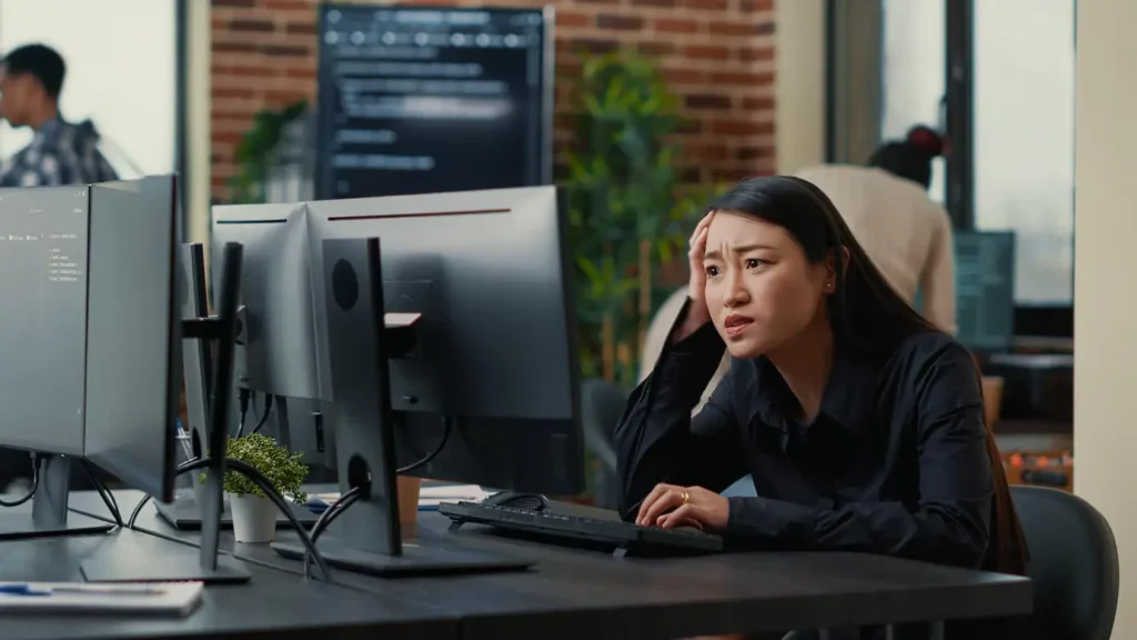 Frustrated woman at desk